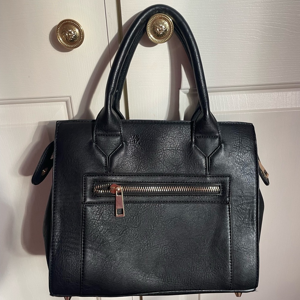 black leather purse with gold embellishments. great for work/ school.